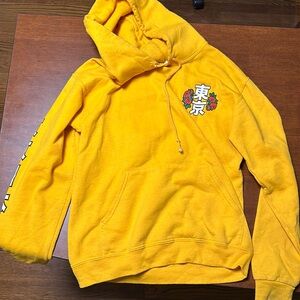 yellow hoodie with tiger on back